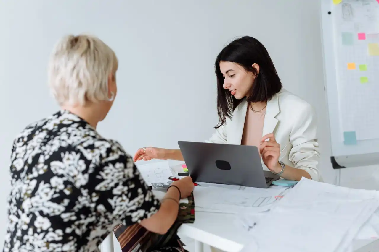 Female holistic practitioner discussing options with woman