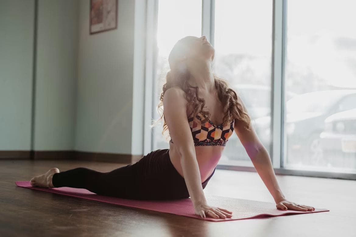 Person lying comfortably engaged in gentle Feldenkrais movement exploration
