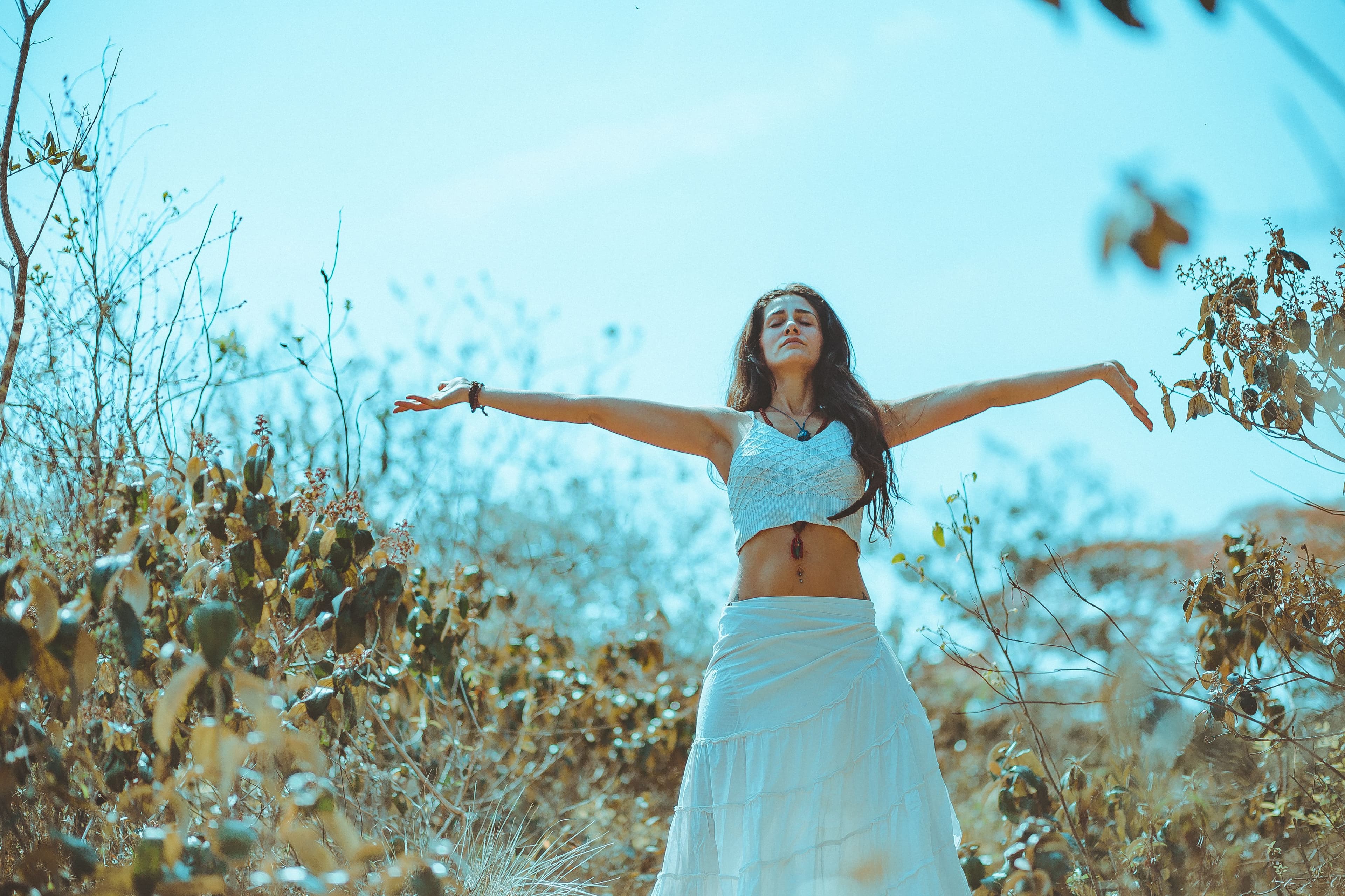 Woman opening her chakras to the universe